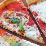 Gluten free pizza with tomato sauce, mozzarella and basil