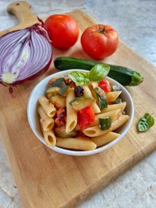Quick & Easy Summer pasta with zucchini, fresh tomatoes and olives.